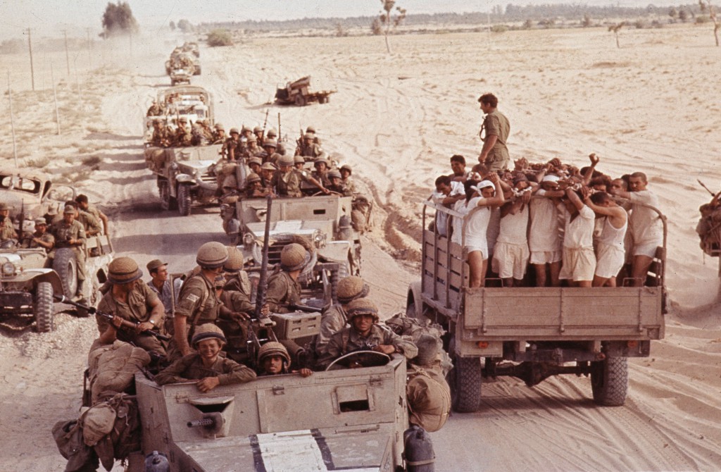 <em>Captured Egyptian soldiers are transported by an Israeli armored convoy to a prisoner of war camp in 1967.</em> Rolls Press/Popperfoto/Getty Images.