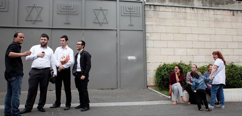 French Jews outside a synagogue in Sarcelles after an attack on July 21. AP Photo/Thibault Camus.
