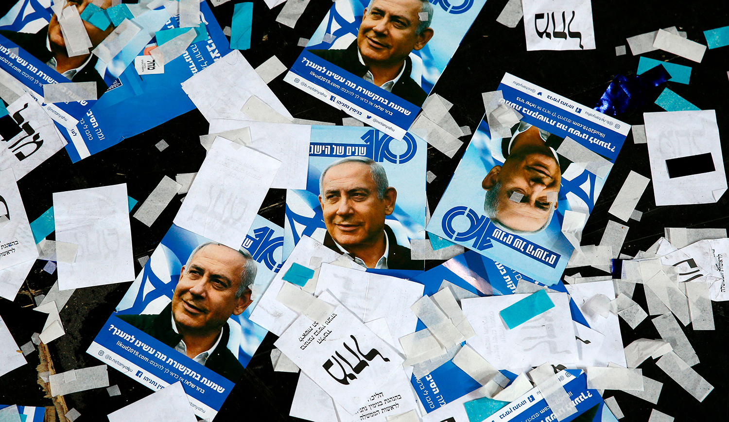 Posters of Benjamin Netanyahu on the floor of Likud party headquarters on election night 2019. JACK GUEZ/AFP/Getty Images.
