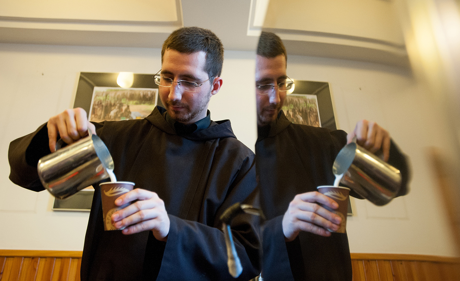 A Capuchin monk making a cappuccino in Krakow, Poland, on January 6, 2013. BARTOSZ SIEDLIK/AFP/Getty Images.
