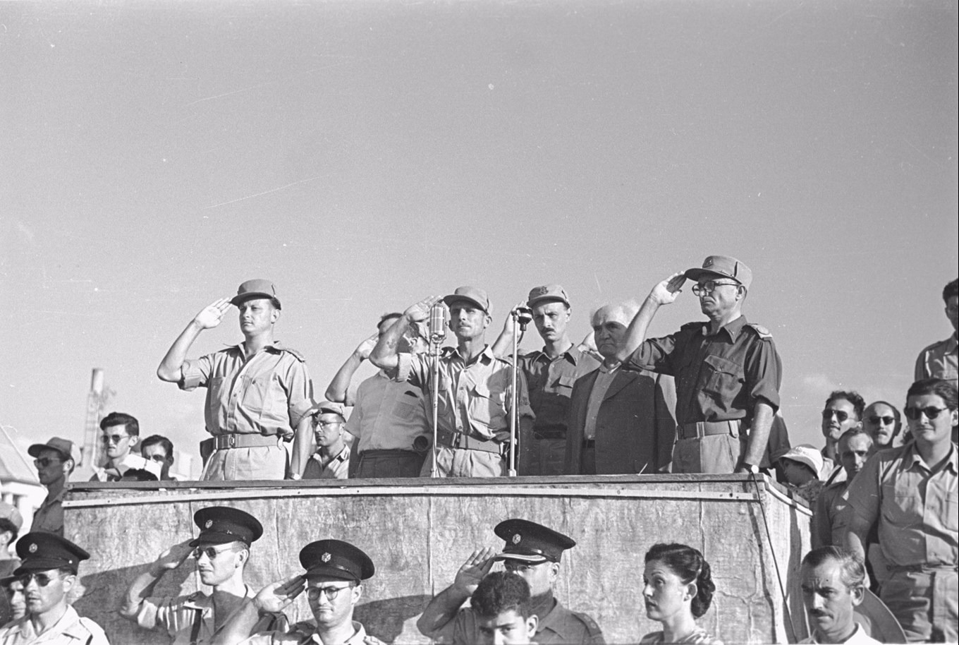 Maj-Gen. Yigal Allon, Lt-Col. Shimon Avidan, Maj-Gen. Yigael Yadin, David Ben-Gurion, and Lt-Gen. Yaakov Dori reviewing the Givati Brigade in 1948. Fred Chesnick, IDF Archive.
