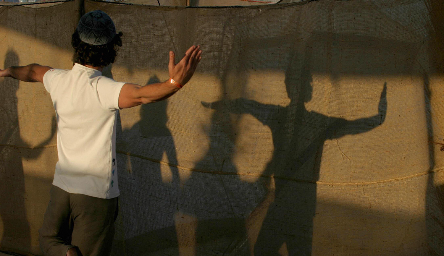 A religious Israeli man practicing a kabbalistic form of yoga. GALI TIBBON/AFP via Getty Images.
