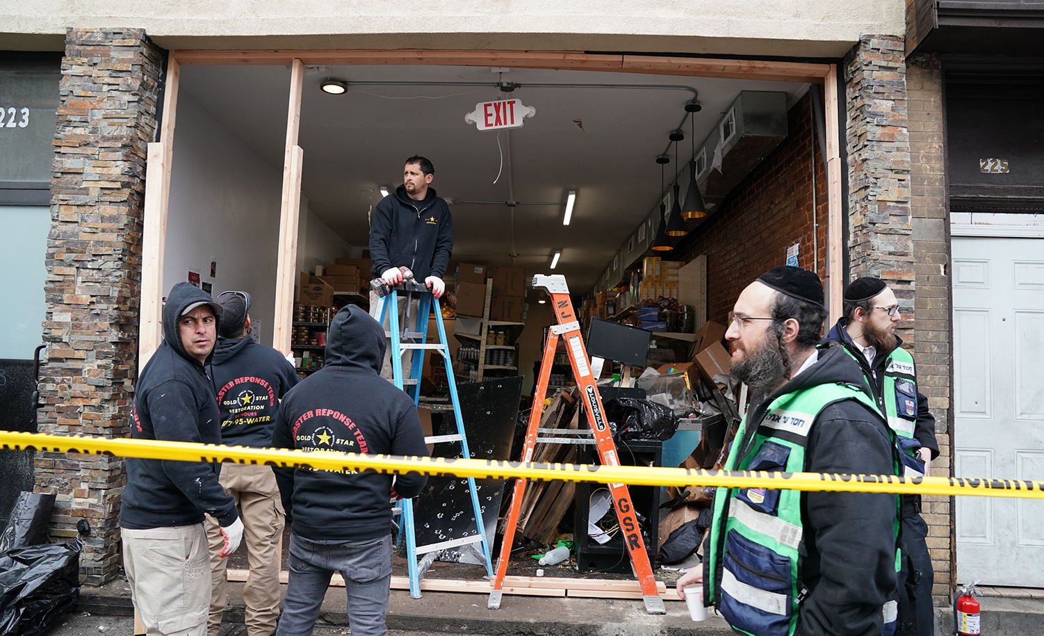 Demolition and recovery crews at the scene of the December 10, 2019 shooting at a Jewish deli in Jersey City, New Jersey. BRYAN R. SMITH/Afp/AFP via Getty Images.
