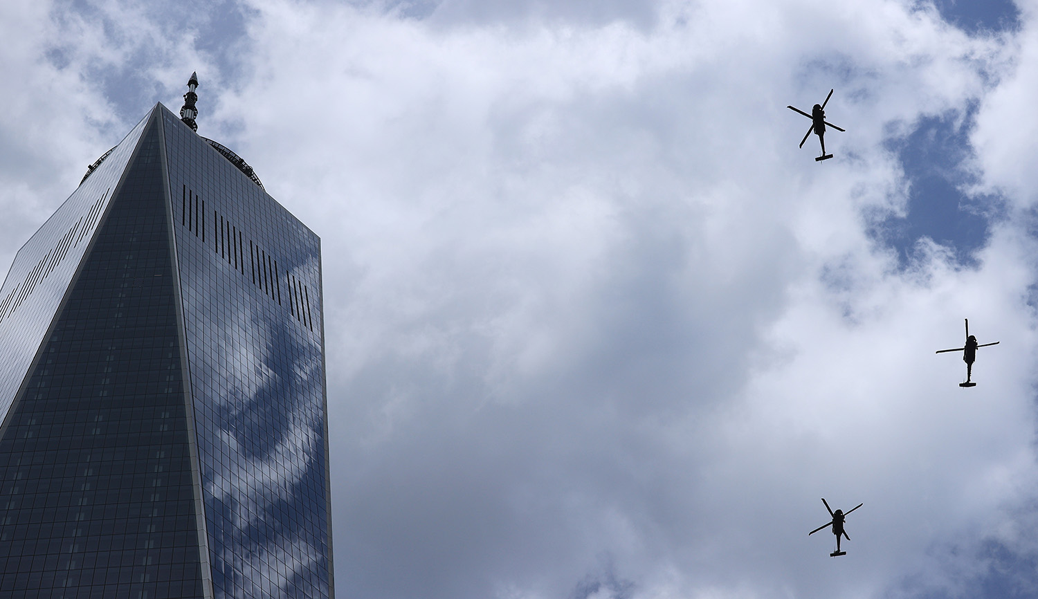 Government helicopters fly past One World Trade Center and the National 9/11 Memorial and Museum on September 11, 2021 in New York City. Chip Somodevilla/Getty Images.
