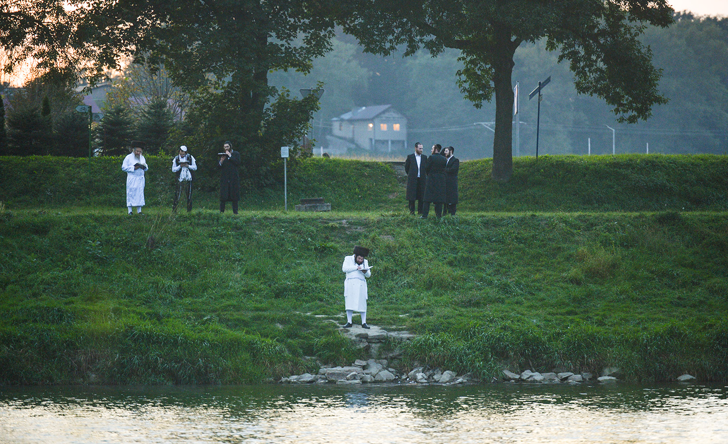 Orthodox Jews praying on the last day of Rosh Hashanah on the bank of the San river in Dynow, Poland on Sunday, September 20, 2020. Artur Widak/NurPhoto via Getty Images.
