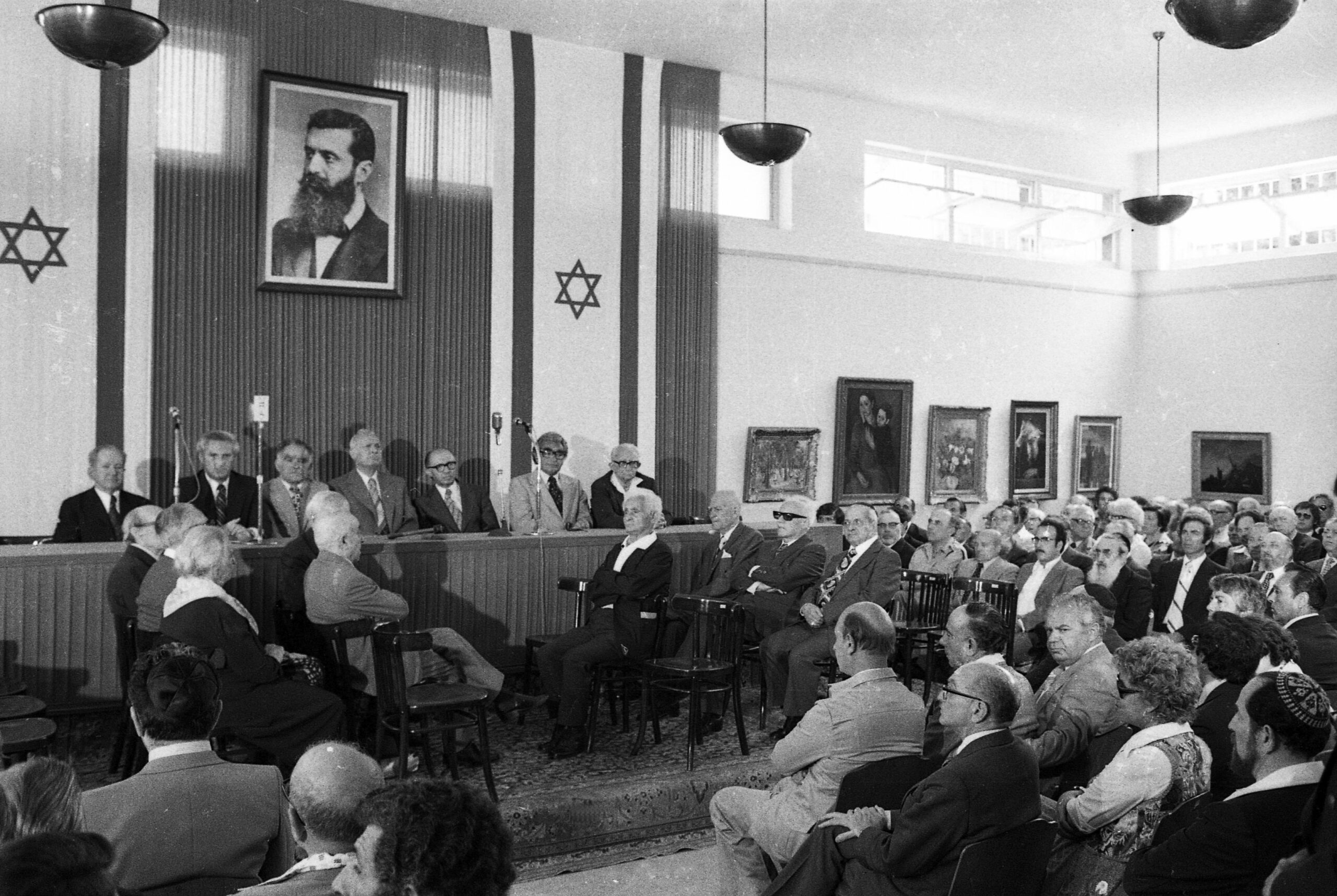 Prime Minister Menachem Begin (on dais) at a reenactment of the declaration ceremony at Independence Hall on May 11, 1978. Dan Hadani Collection, Pritzker Family National Photography Collection, National Library of Israel.

