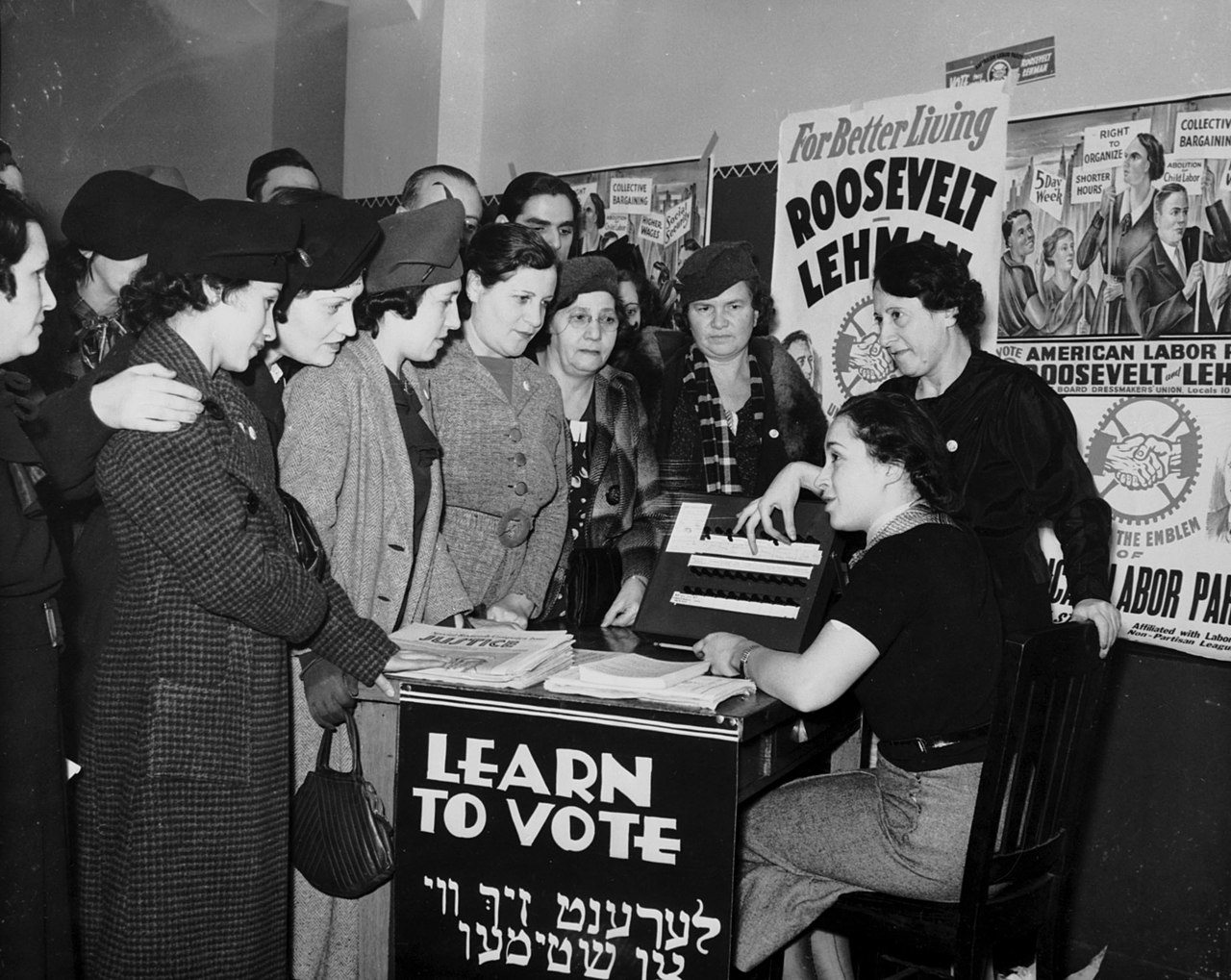 Women surrounded by posters in English and Yiddish supporting Franklin D. Roosevelt teach other women how to vote in 1935. International Ladies Garment Workers Union Photographs (1885-1985), Kheel Center for Labor-Management Documentation and Archives, Cornell University Library.
