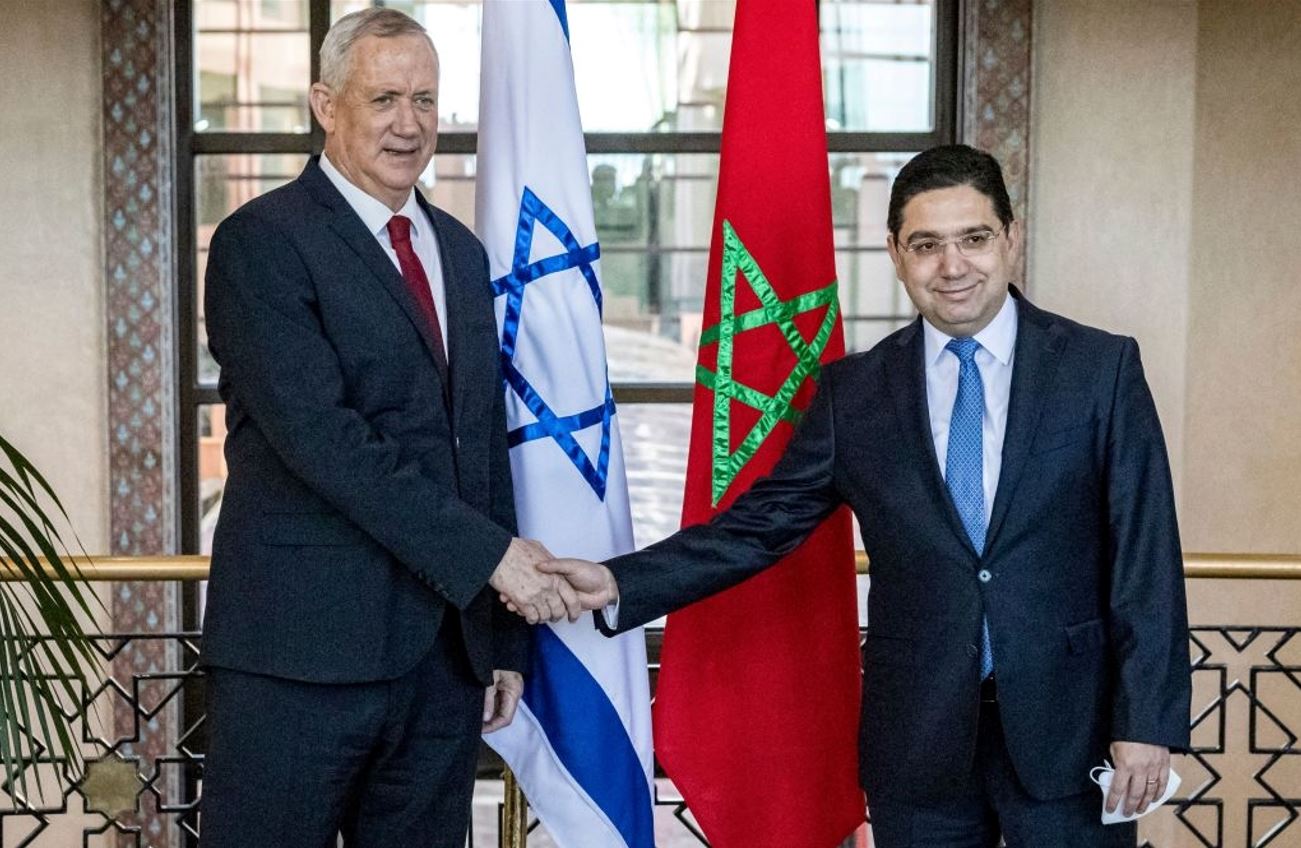 Morocco&#8217;s foreign minister Nasser Bourita shakes hands with Israel&#8217;s defense minister Benny Gantz in the Moroccan capital Rabat on November 24, 2021. Photo by FADEL SENNA/AFP via Getty Images.
