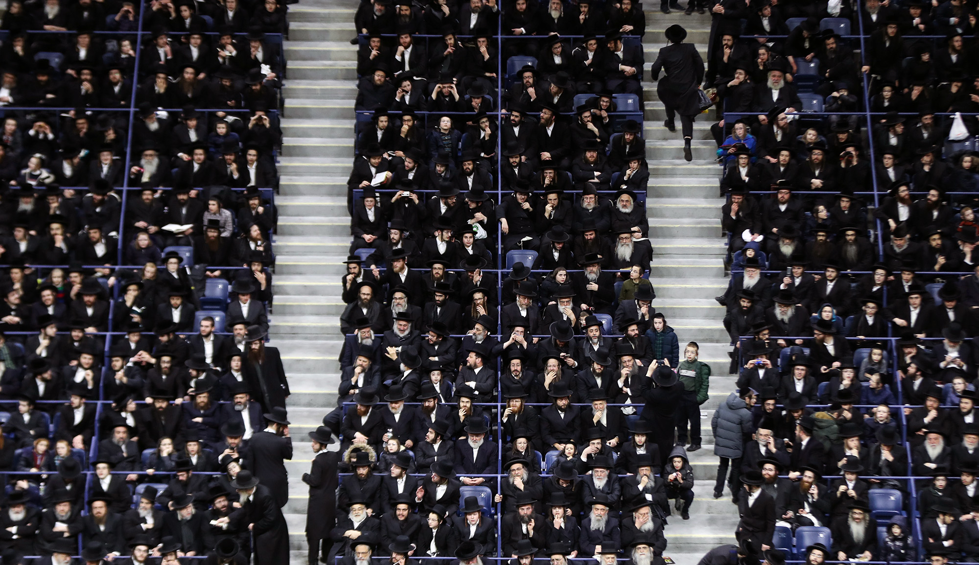 Thousands of haredi Jews gather at Arthur Ashe Stadium in Queens, New York to raise donations for educational institutions in Israel on April 12, 2019. Atilgan Ozdil/Anadolu Agency/Getty Images.
