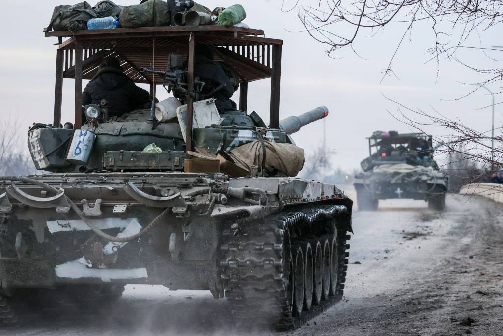Russian tanks move through the town of Armyansk, Ukraine, as part of the Russian invasion on February 24, 2022.  Photo by Sergei Malgavko\TASS via Getty Images.

