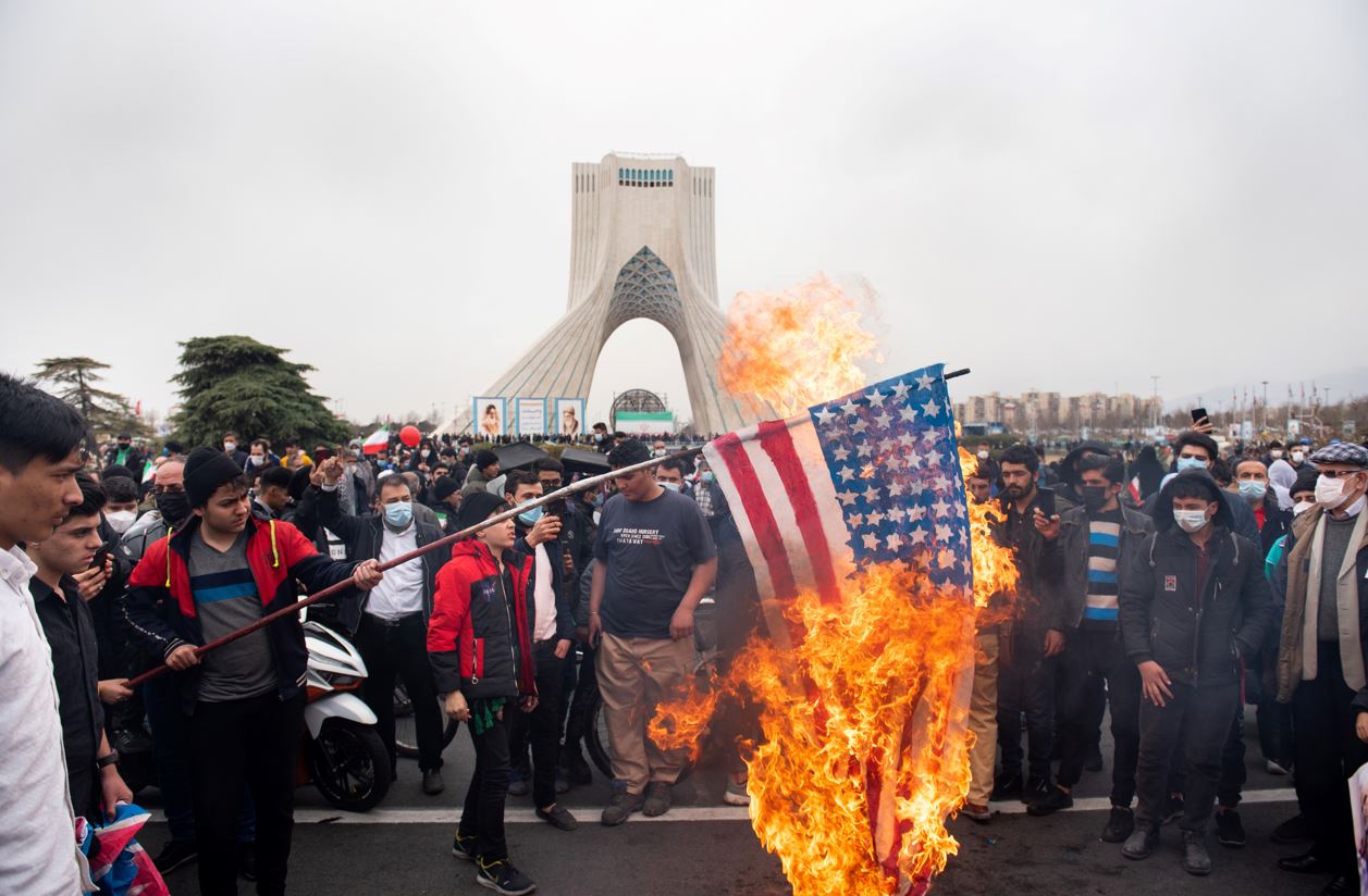 Iranians burn the American flag during a rally to commemorate the 43rd anniversary of the Islamic Revolution on February 22, 2022. Photo by Sobhan Farajvan/Pacific Press/LightRocket via Getty Images.
