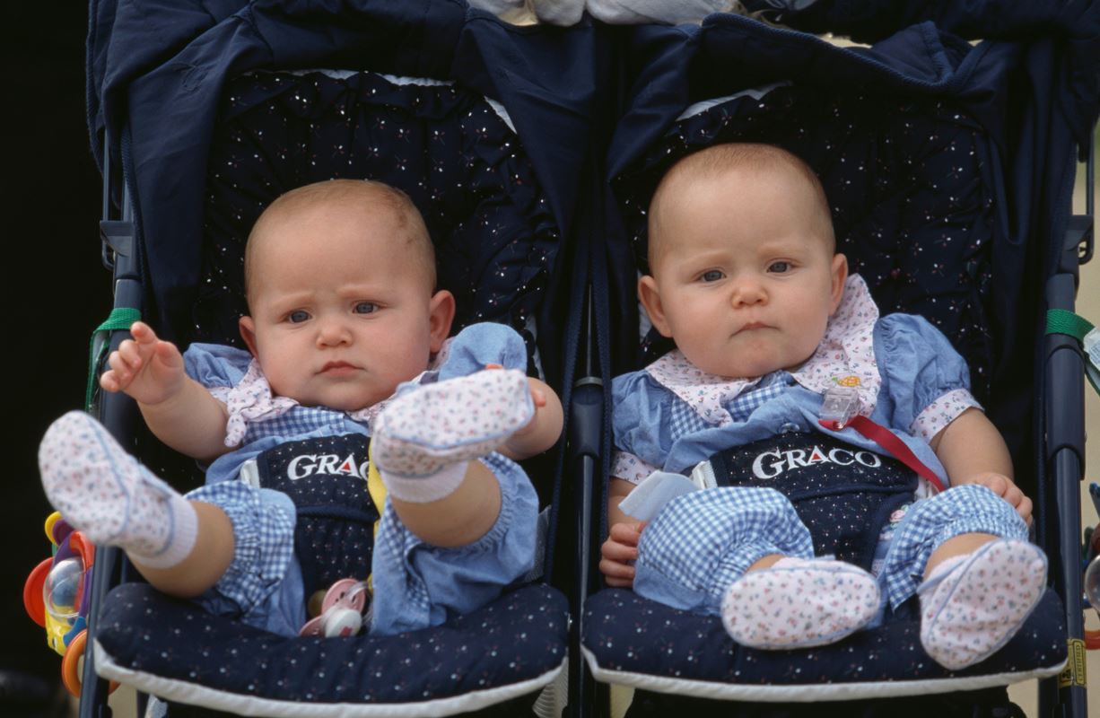 Two babies at the annual twin festival in Twinsburg, Ohio, on August 3, 1997. Photo by Georges De Keerle via Getty Images.
