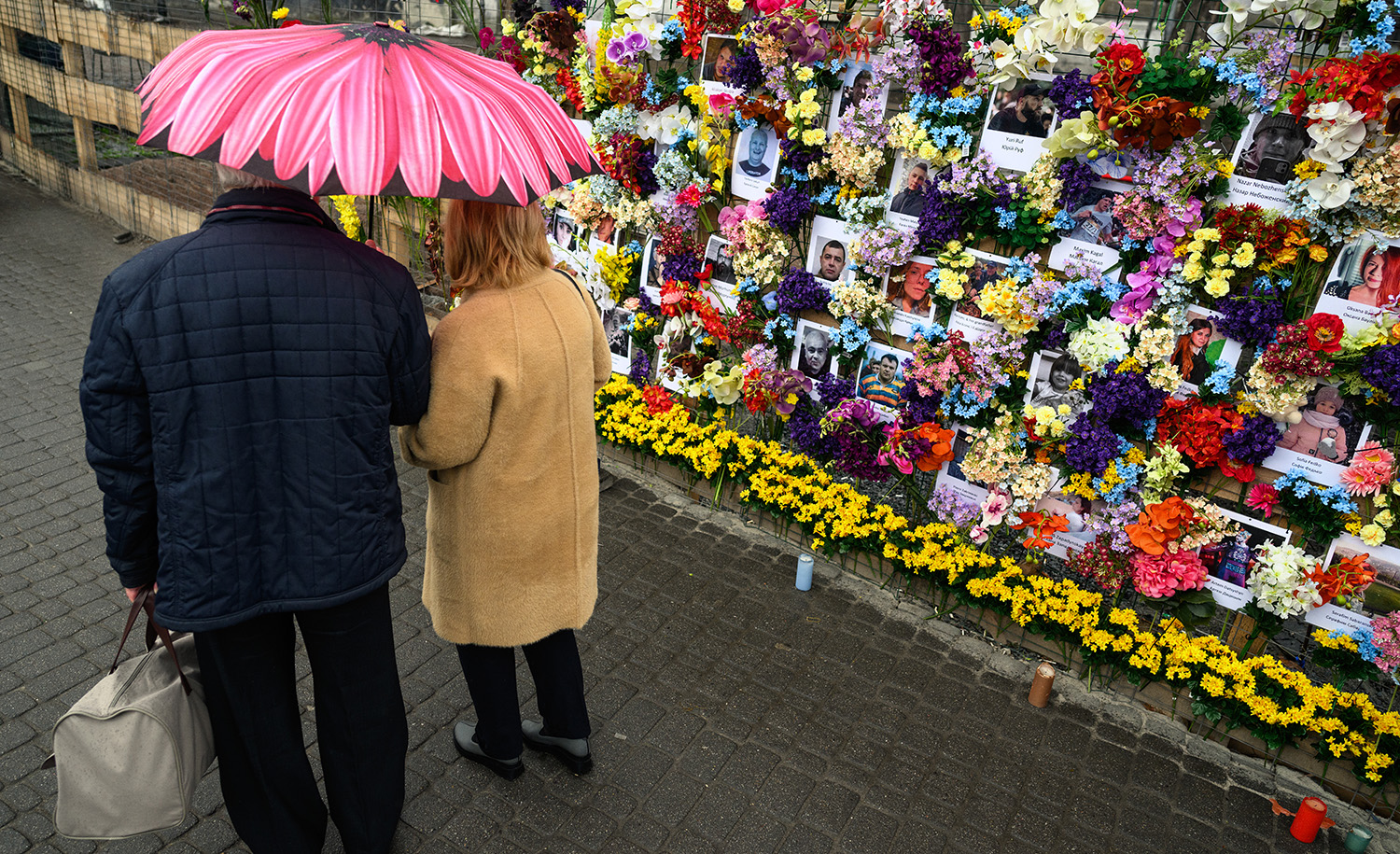 A floral memorial wall for Ukrainian civilians killed during the Russian invasion on April 24, 2022 in Lviv, Ukraine. Leon Neal/Getty Images.

