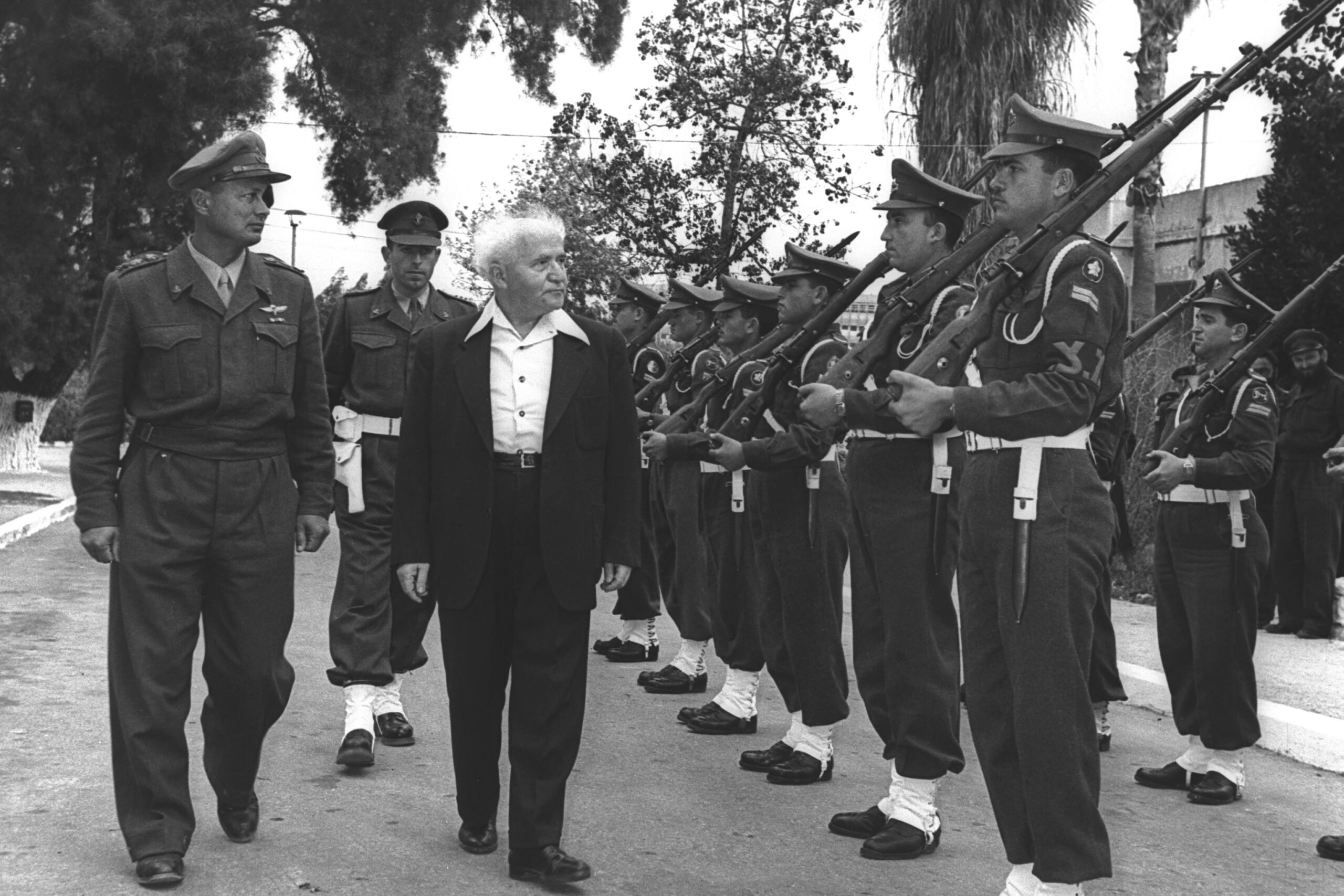 David Ben-Gurion, accompanied by Moshe Dayan, inspecting a guard of honor outside his office in Tel Aviv in 1955. HANS PIN/Israeli National Photo Collection.

