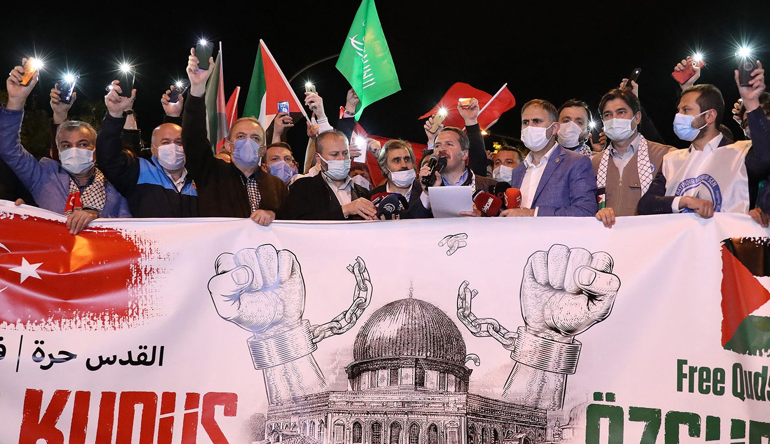 Protesters hold Palestinian and Turkish flags and chant slogans during a demonstration outside the Israeli consulate in Istanbul on May 10, 2021. ADEM ALTAN/AFP via Getty Images.
