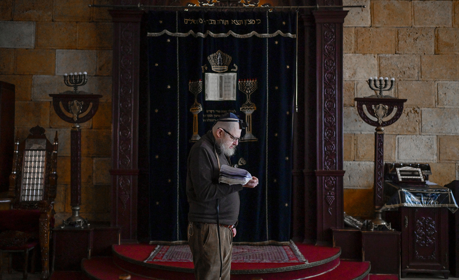 A Jewish man prays in the Chabad Synagogue in Odessa on March 9, 2022. BULENT KILIC/AFP via Getty Images.
