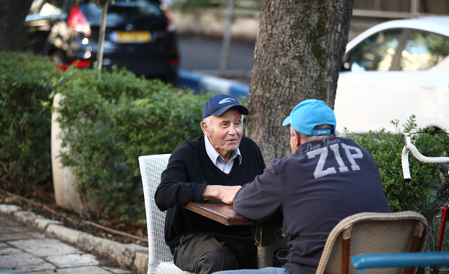 
Two men talking at the Butke Cafe in Jerusalem in 2014. Dan Porges/Getty Images.








