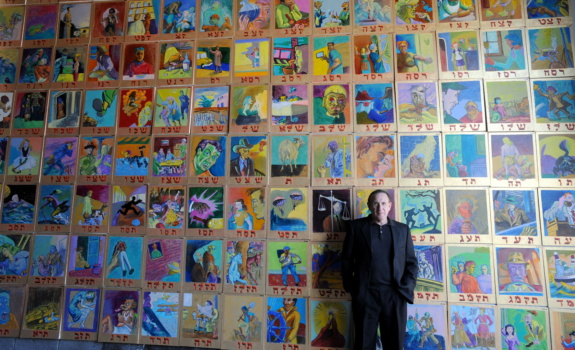 Archie Rand in front of his 613 series in a warehouse in Brooklyn in 2008. Todd Maisel/NY Daily News Archive via Getty Images.
