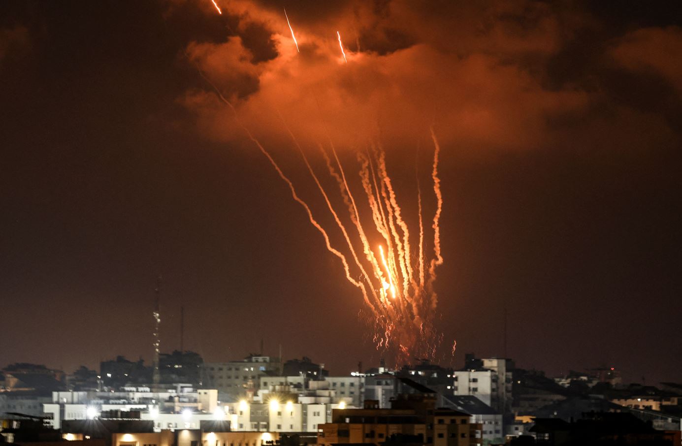 Palestinian rockets are fired from Gaza City at Israel on August 5, 2022. Photo by MAHMUD HAMS/AFP via Getty Images. 
