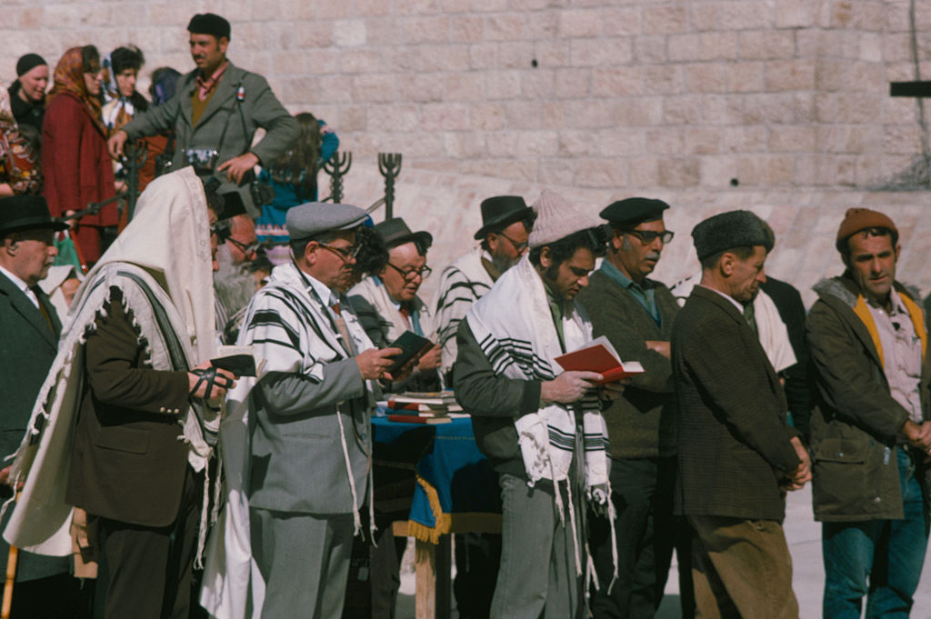 Men pray at the Western Wall in the Old City of Jerusalem, 1975. Photo by Archive Photos via Getty Images.
