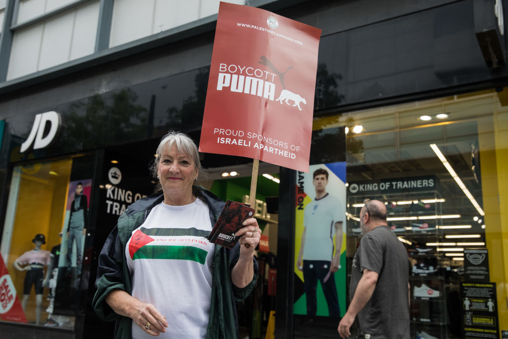In July 2021, a pro-Palestinian activist protests against Puma for sponsoring the Israeli Football Association. Mark Kerrison/In Pictures via Getty Images.
