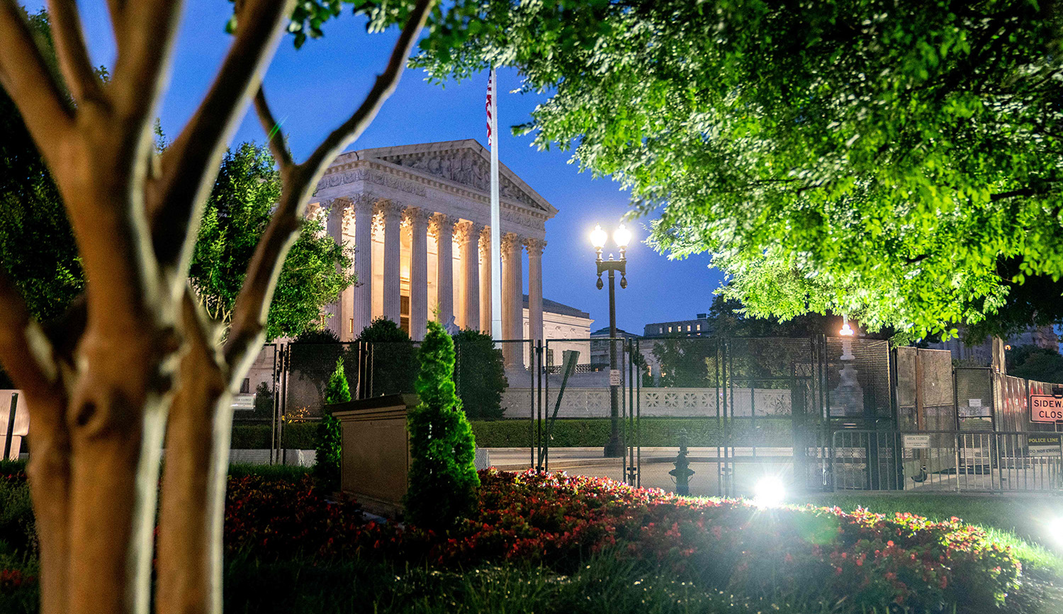 
Temporary security fencing surrounds the Supreme Court in Washington, D.C., on June 21, 2022.  STEFANI REYNOLDS/AFP via Getty Images.






