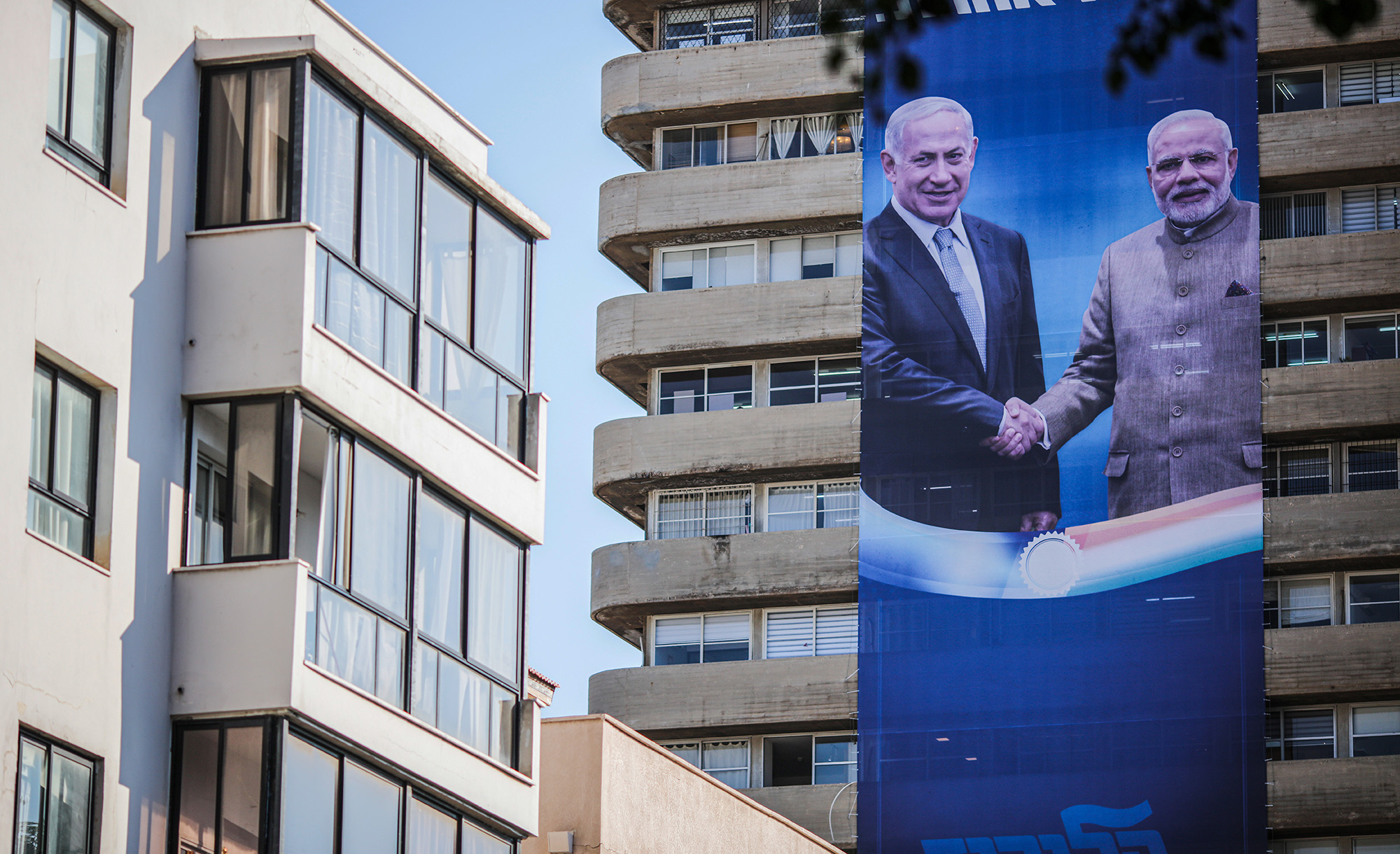 An election campaign banner showing Benjamin Netanyahu shaking hands with Narendra Modi in September 2019. Ilia Yefimovich/picture alliance via Getty Images.
