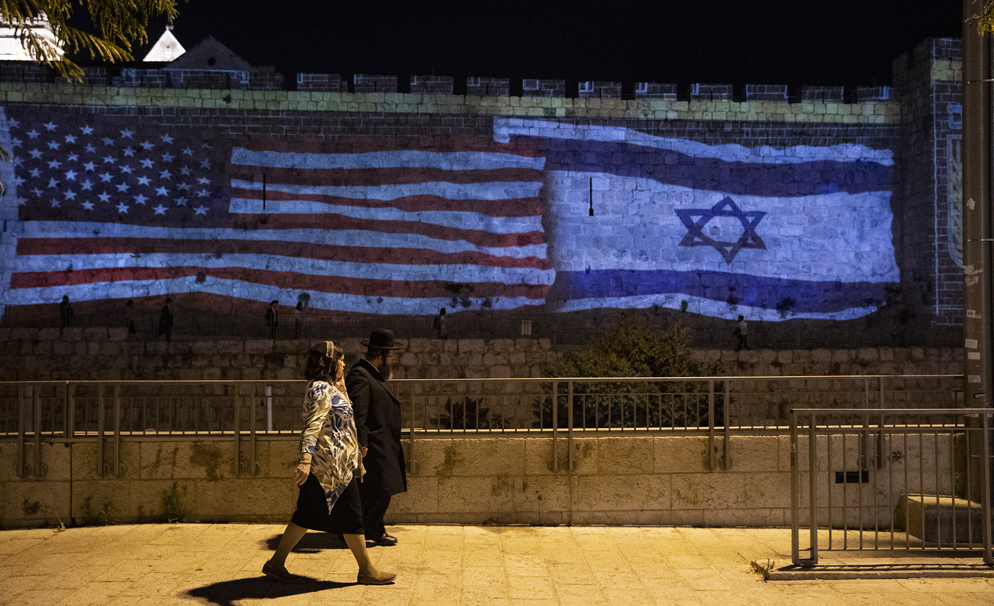 
U.S and Israeli flags are projected onto the historical walls near Hebron Gate in Jerusalem during U.S President Joe Biden&#8217;s visit on July 14, 2022. Mostafa Alkharouf/Anadolu Agency via Getty Images.






