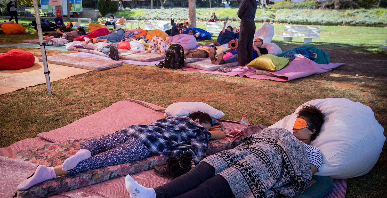 



People sleep during a public napping event in central Jerusalem on November 2, 2018. Yonatan Sindel/Flash90.




