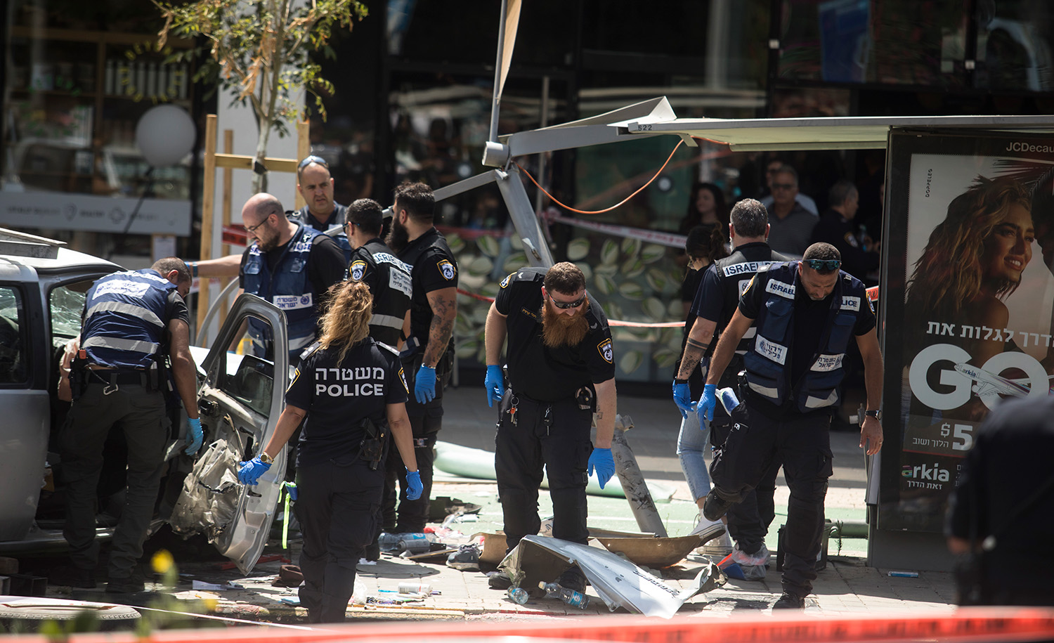 
Israeli emergency services at the scene of a terror attack on July 4, 2023 in Tel Aviv. Several people were injured after a car rammed into pedestrians and the driver then stabbed several people before being killed, according to Israeli officials. Amir Levy/Getty Images.






