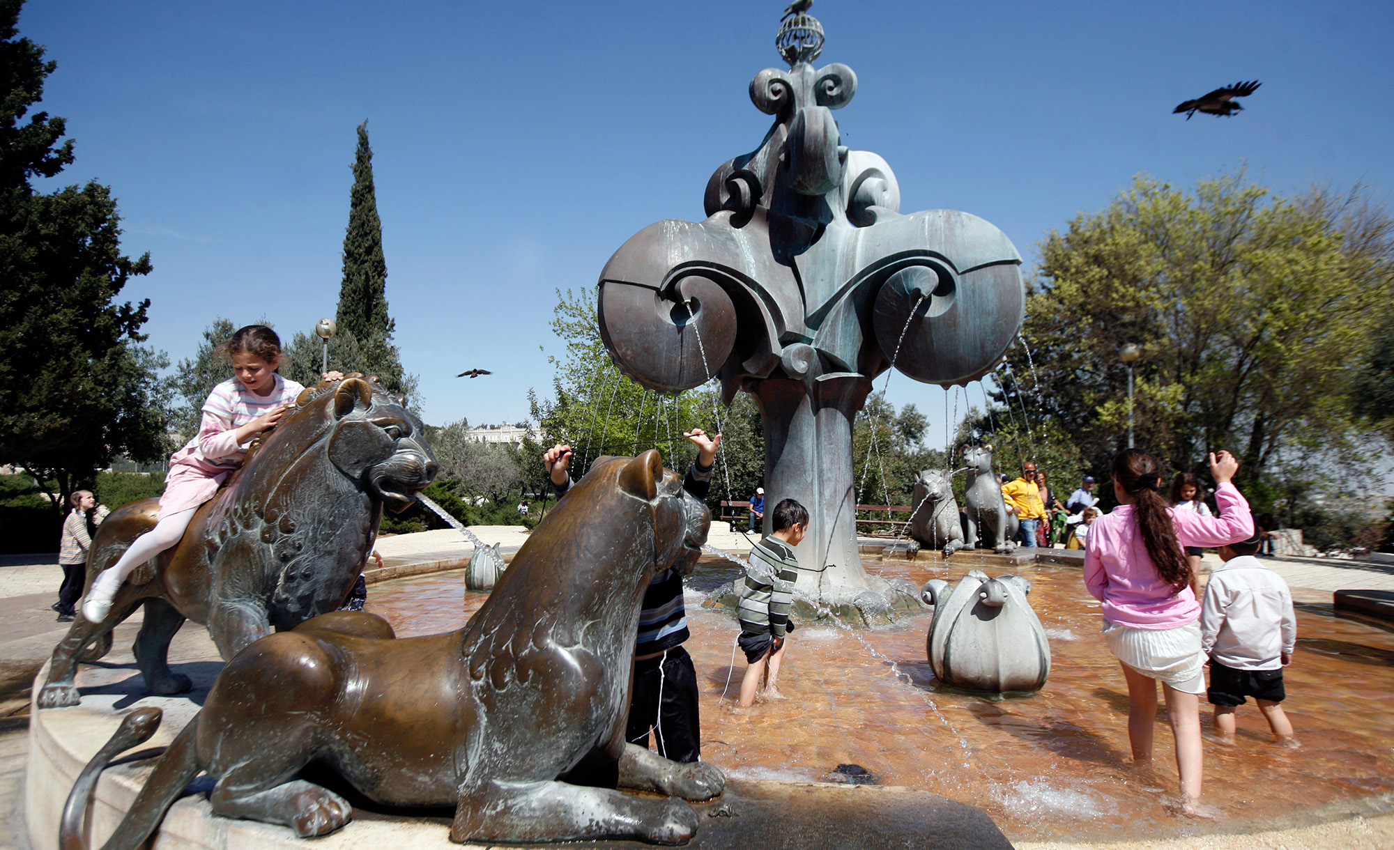 



Young Jewish children play in a fountain in Jerusalem during Passover on March 31, 2010. Miriam Alster/FLASH90.




